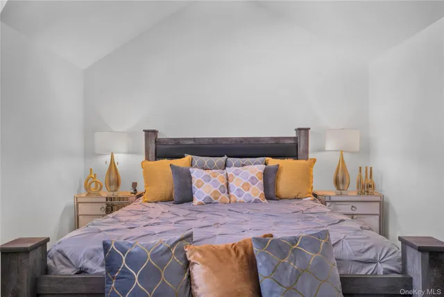 a bedroom with a bed and chair