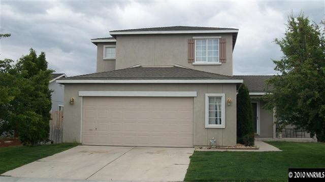 11974 Kernite Street Reno, NV 89506 - Photo 1 of 6 a front view of a house with a garden