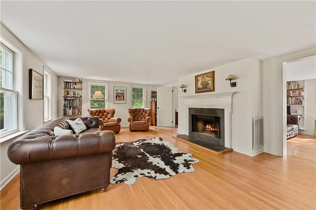 189 Old Long Ridge Road Stamford, CT 06903 - Photo 1 of 1 a living room with furniture and a fireplace