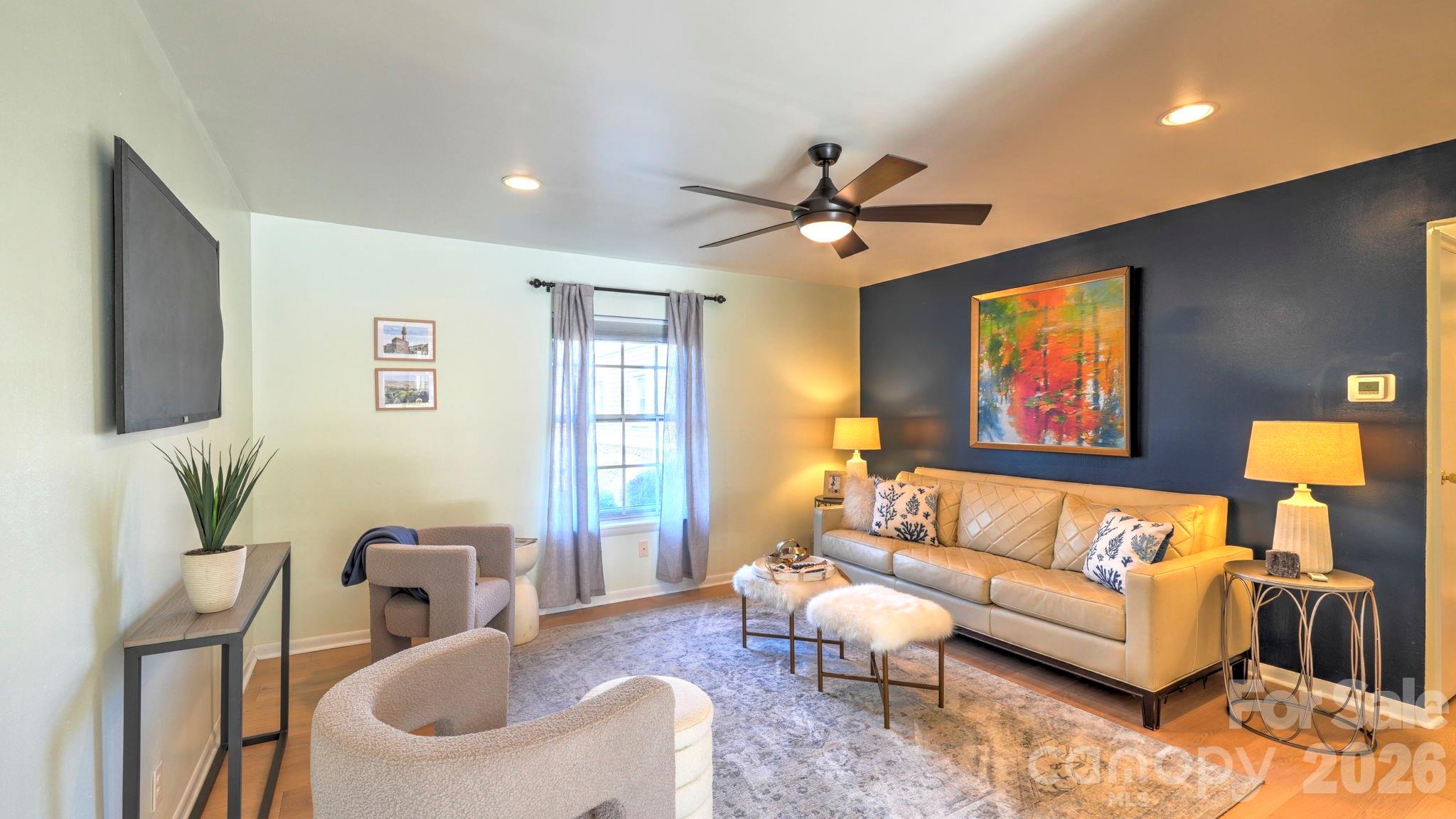 2626 Park Road, Unit B Charlotte, NC 28209 - Photo 2 of 31 a living room with furniture ceiling fan and a rug
