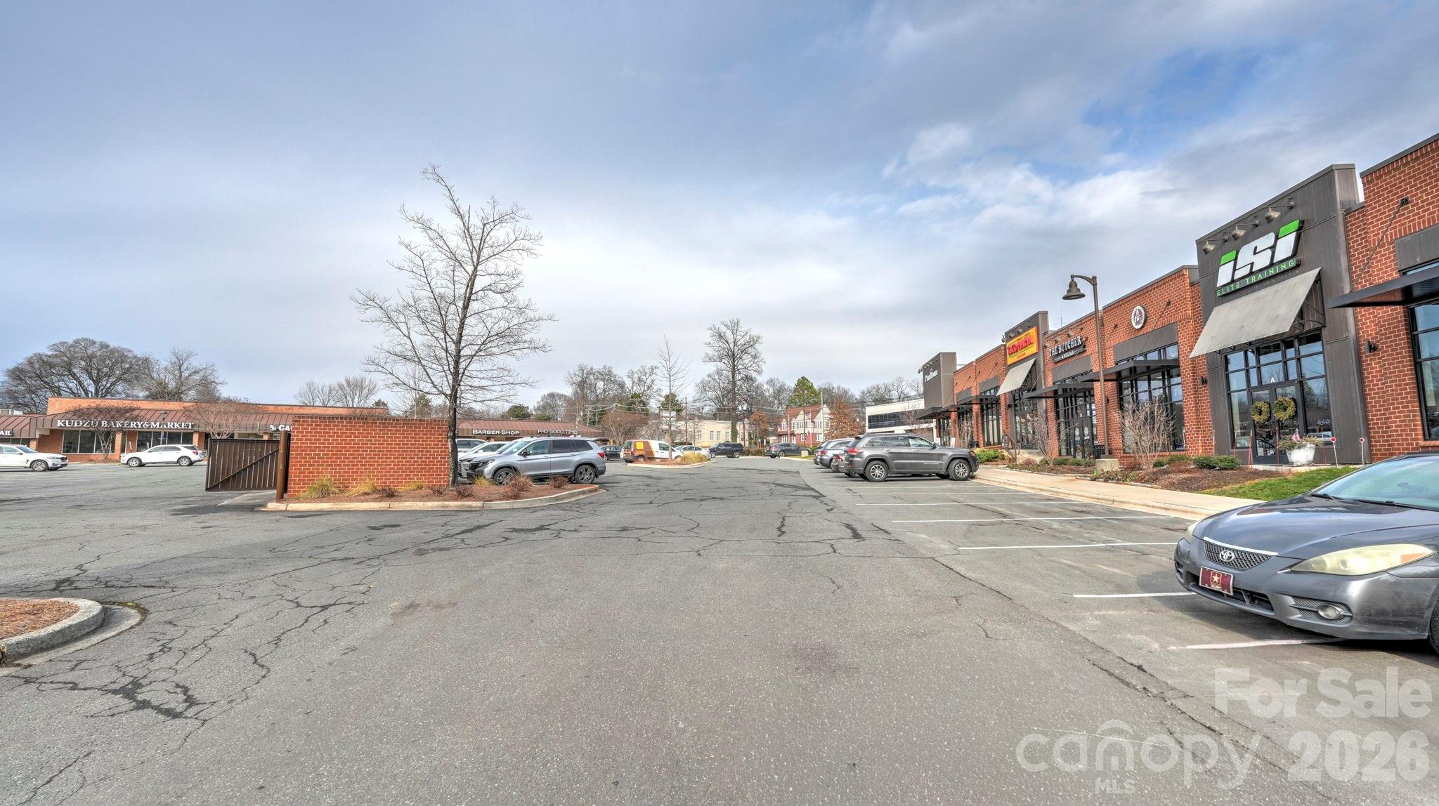 2626 Park Road, Unit B Charlotte, NC 28209 - Photo 28 of 31 a city street lined with tall buildings