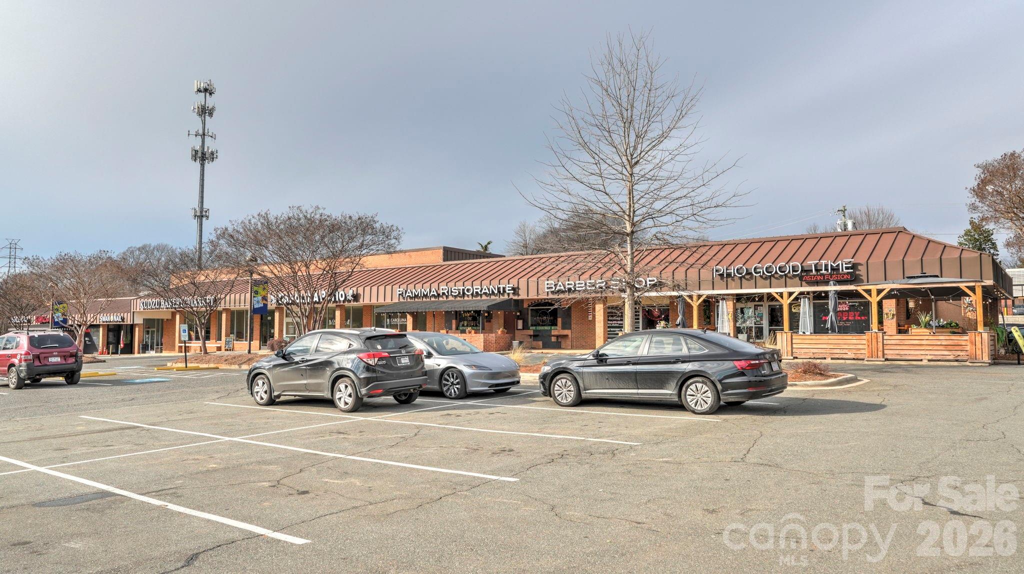 2626 Park Road, Unit B Charlotte, NC 28209 - Photo 29 of 31 a car parked in front of building