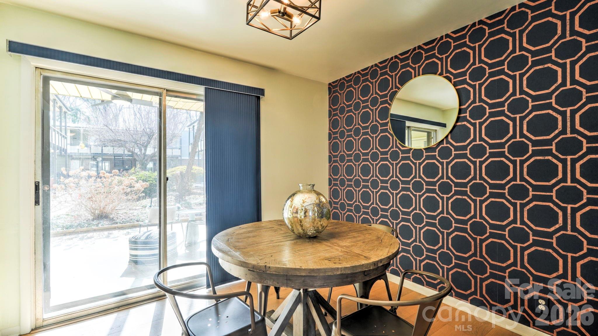 2626 Park Road, Unit B Charlotte, NC 28209 - Photo 7 of 31 a view of a dining room with furniture and wooden floor