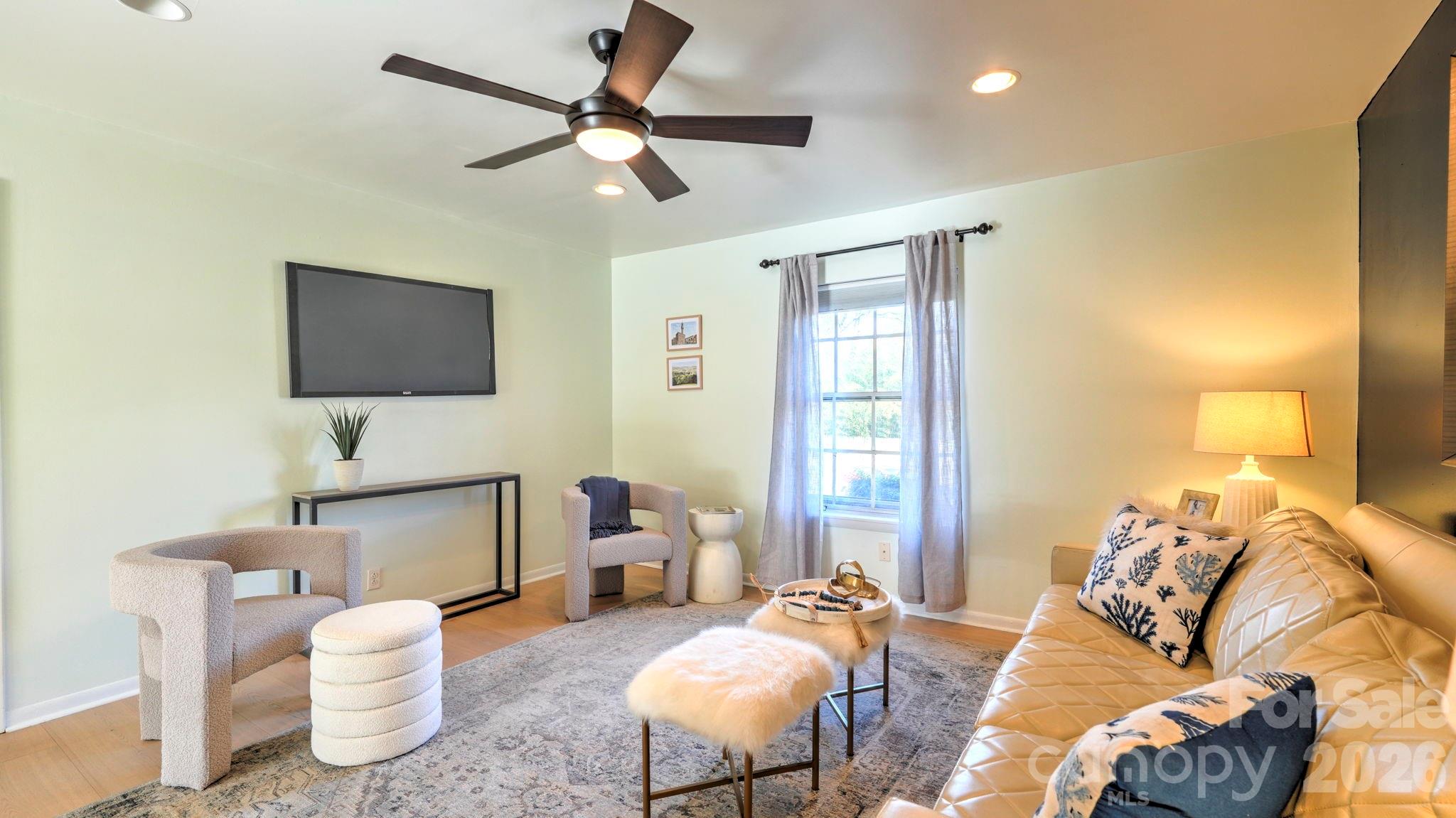 2626 Park Road, Unit B Charlotte, NC 28209 - Photo 8 of 31 a living room with furniture and a flat screen tv