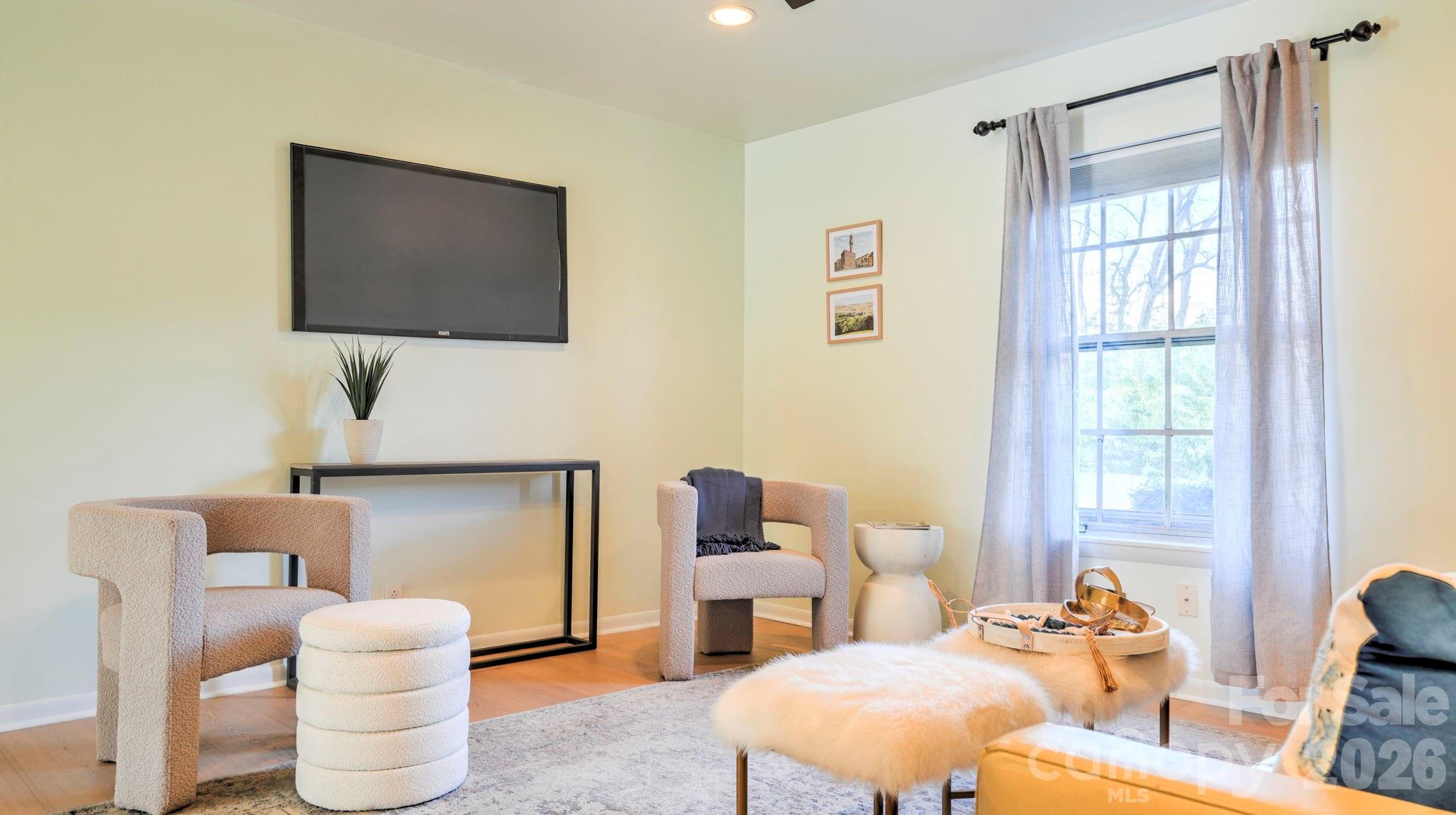 2626 Park Road, Unit B Charlotte, NC 28209 - Photo 9 of 31 a living room with furniture and a flat screen tv