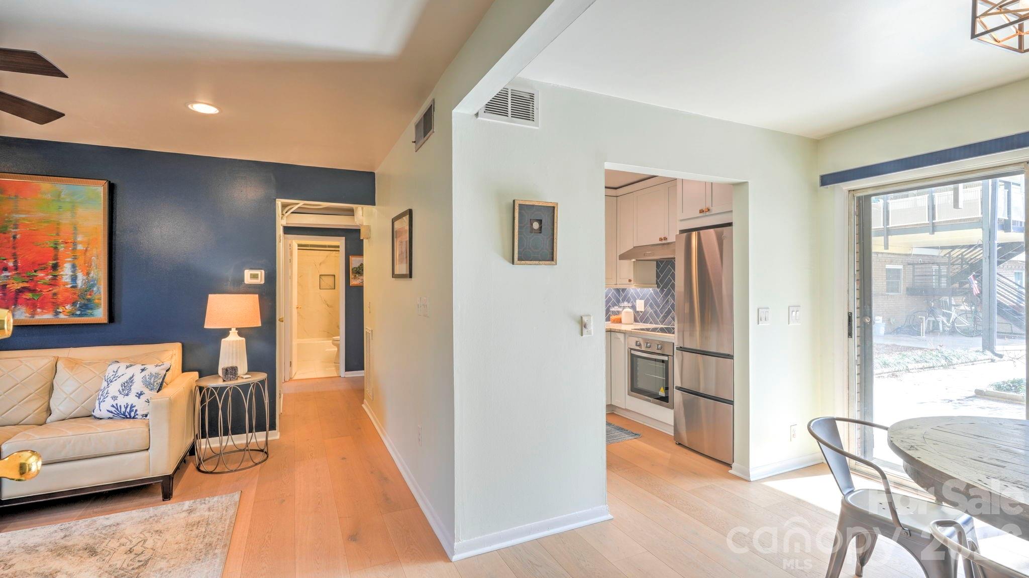 2626 Park Road, Unit B Charlotte, NC 28209 - Photo 10 of 31 a living room with furniture and a kitchen view