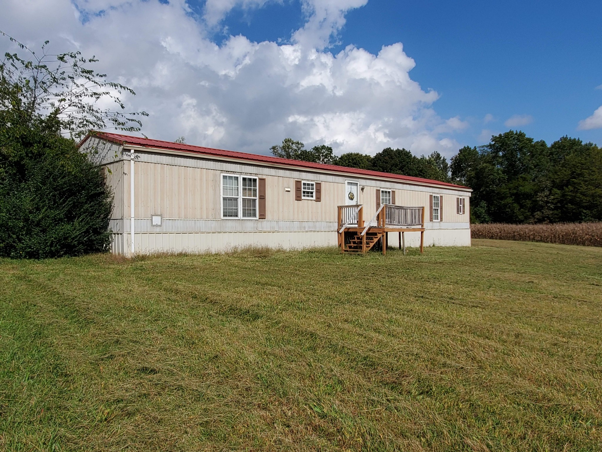 202 Baker Road Morrison, TN 37357 - Photo 9 of 13 a backyard of a house with table and chairs