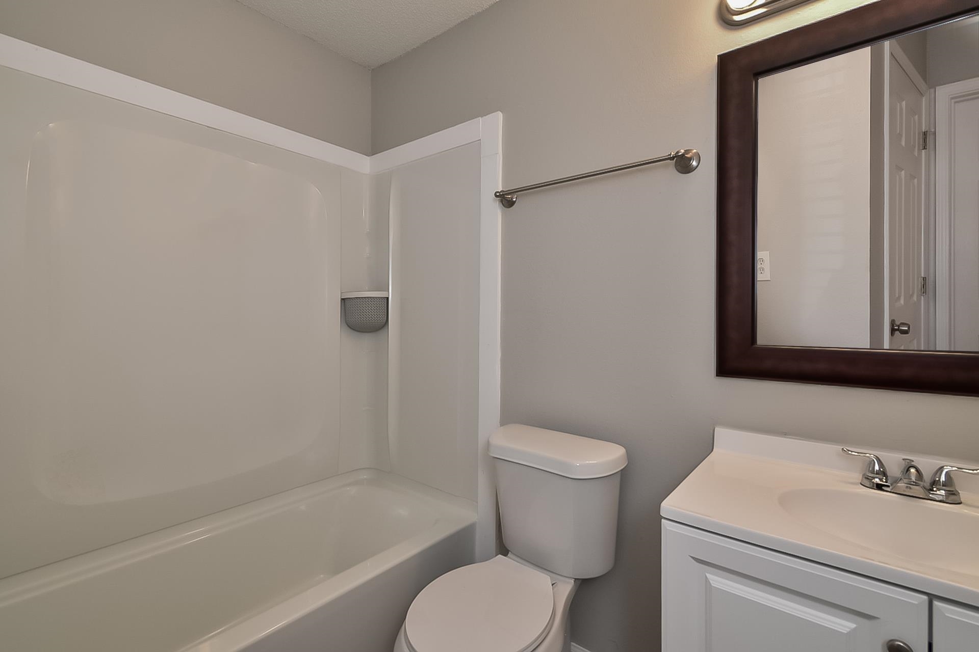 4539 Longtree Avenue Memphis, TN 38128 - Photo 12 of 16 a bathroom with a sink toilet and shower