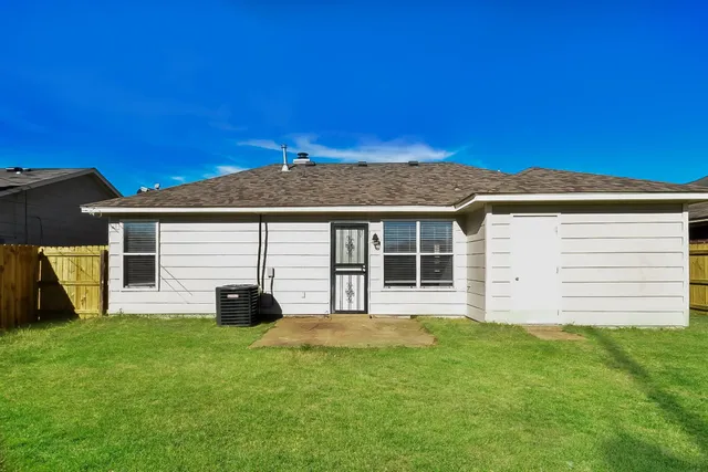 a house view with a garden space