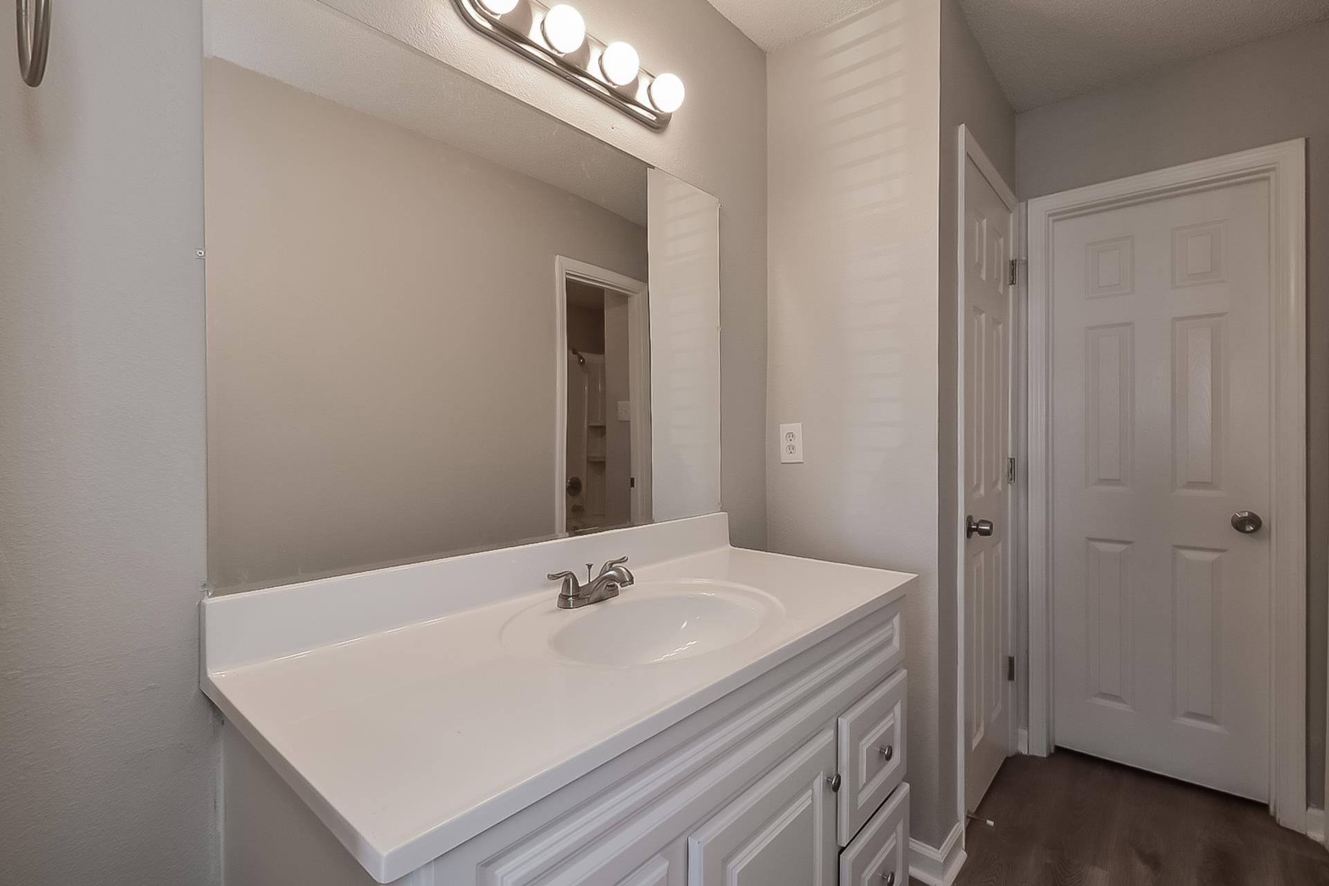 4539 Longtree Avenue Memphis, TN 38128 - Photo 9 of 16 a bathroom with a sink vanity and a mirror