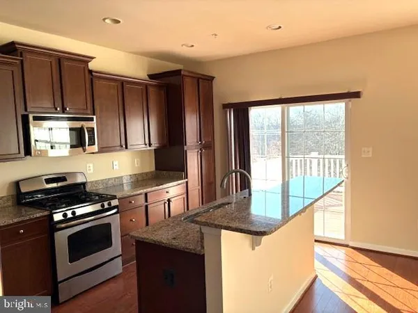 a view of two room with large windows