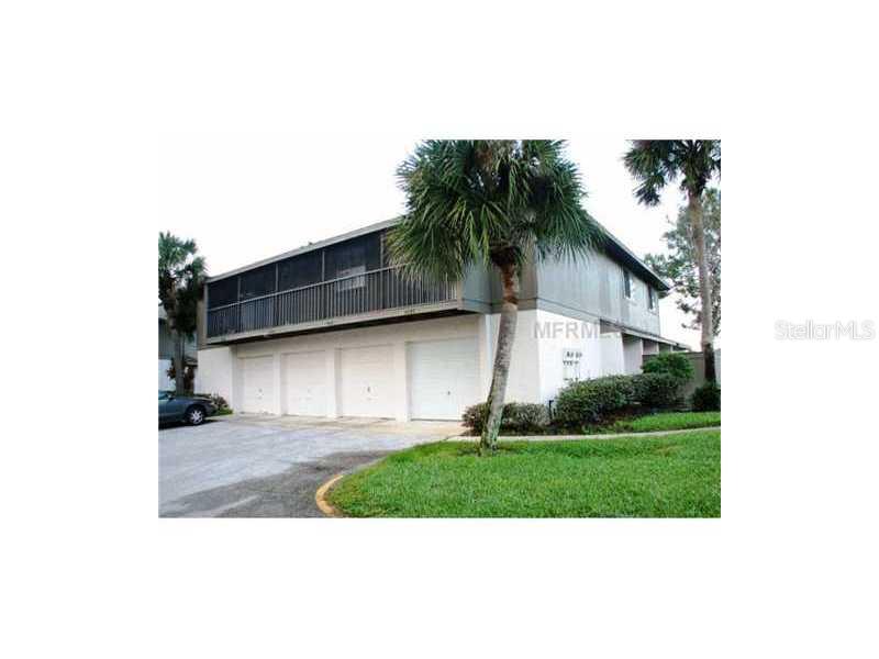 4500 Ring Neck Road, Unit 29A Orlando, FL 32808 - Photo 1 of 1 a view of a backyard with plants and palm tree