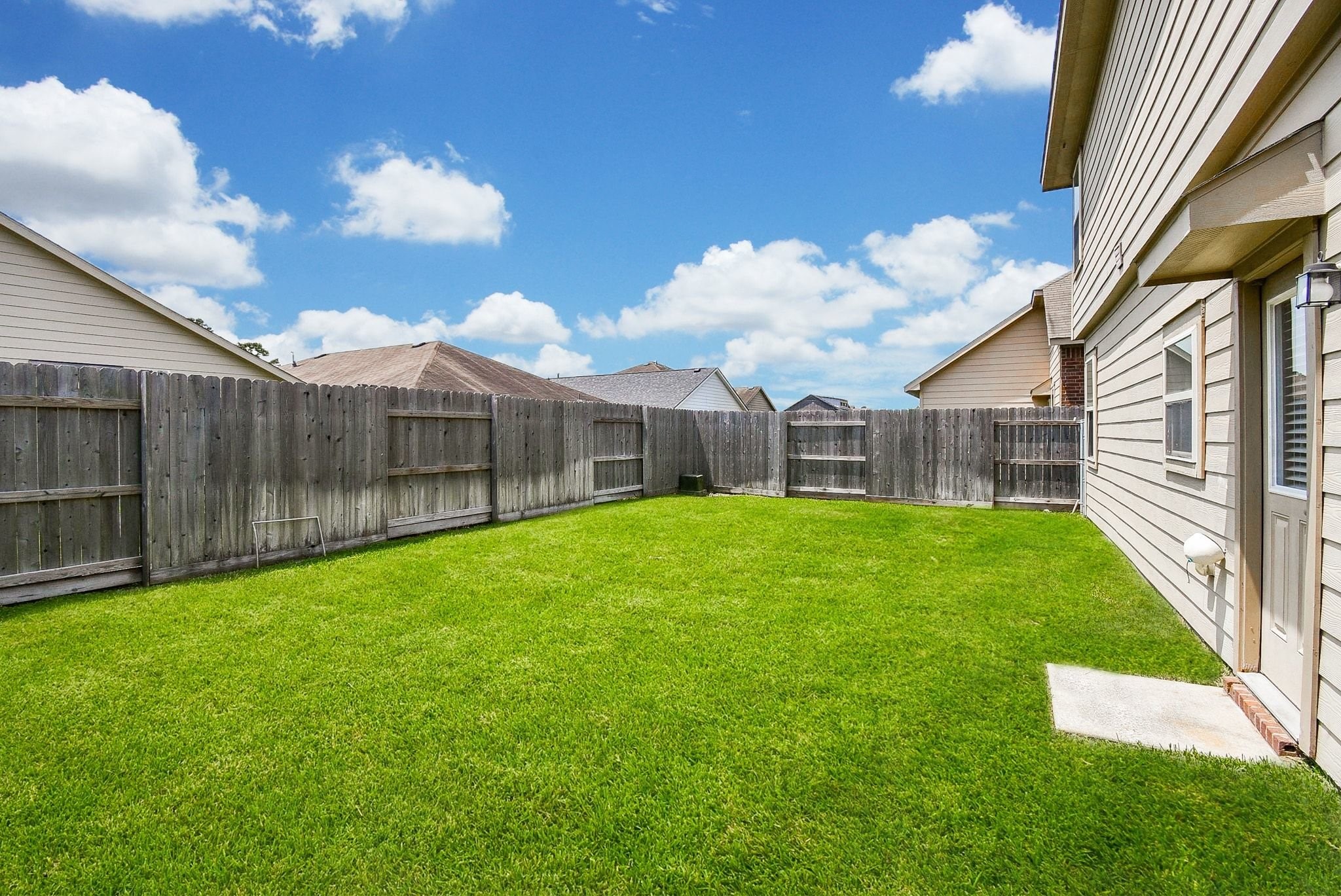 2106 Harmon Crest Court Spring, TX 77373 - Photo 3 of 37 a view of a house with a yard and porch