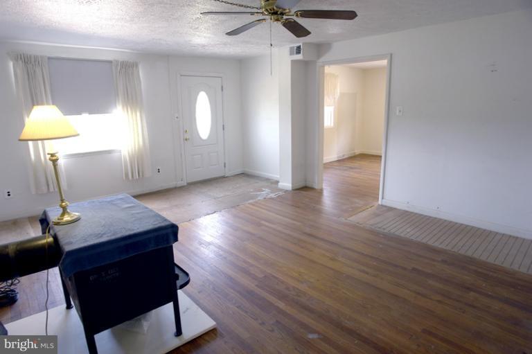 7530 Brink Road Gaithersburg, MD 20882 - Photo 11 of 30 Living Room has the original hardwood floor.