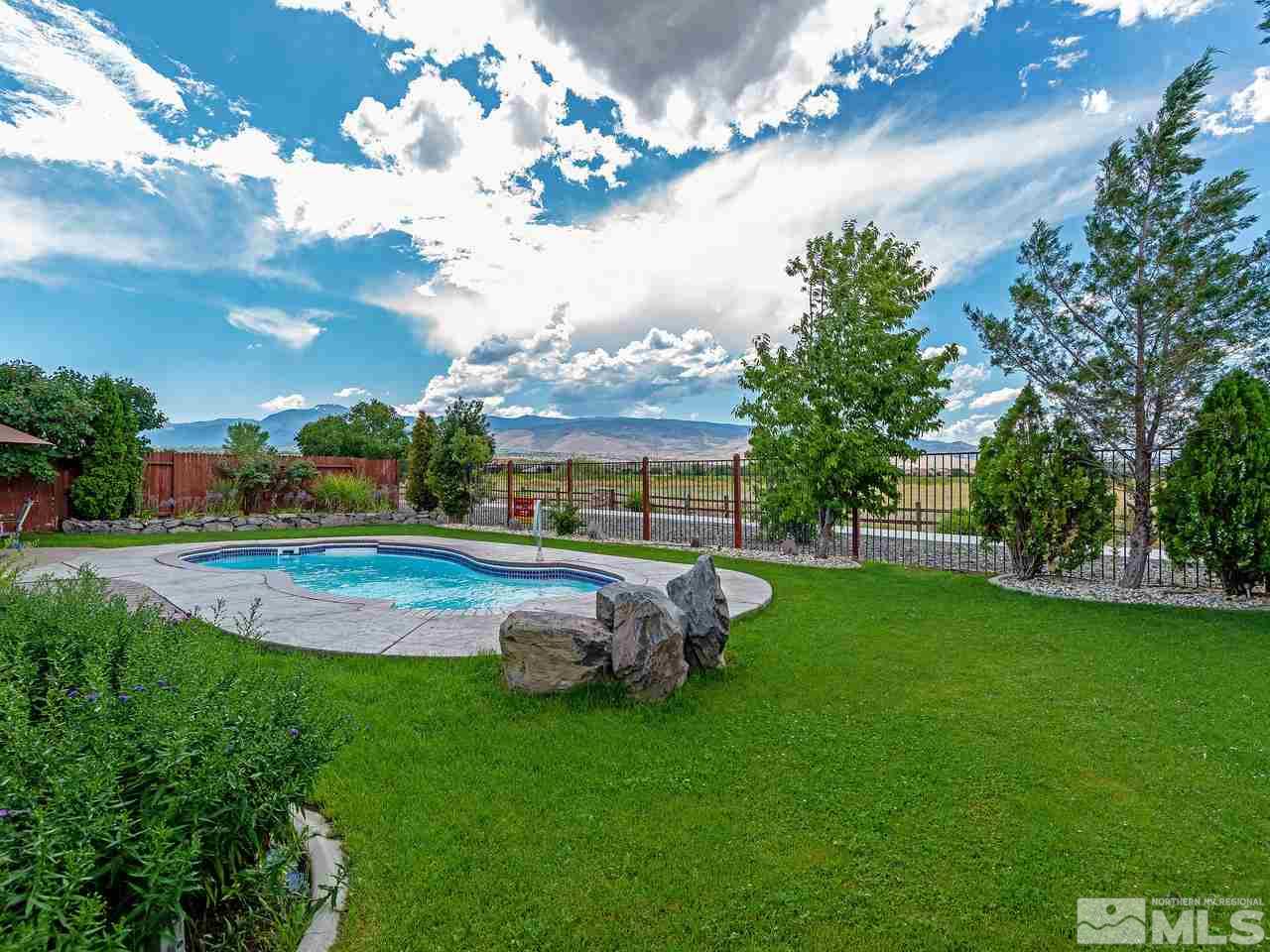 10675 Silver Cliff Way Reno, NV 89521 - Photo 3 of 16 a view of a garden with lawn chairs