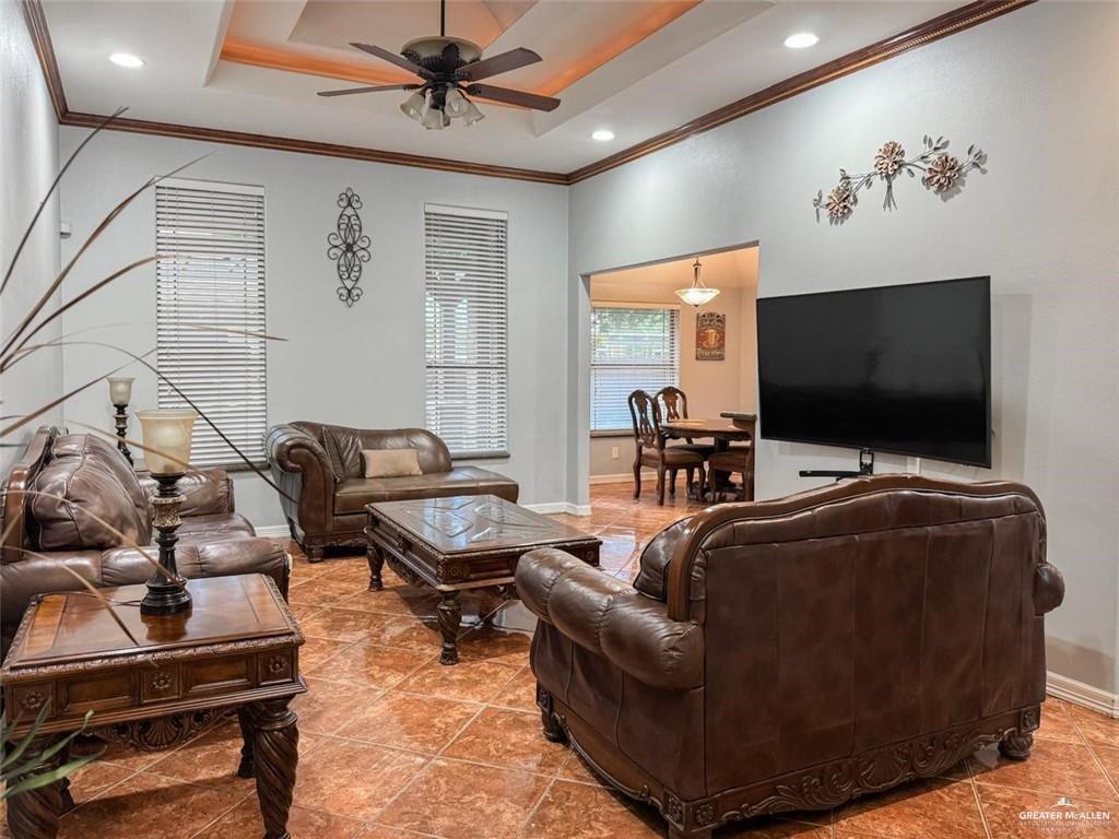 120 South Retama Lane Weslaco, TX 78596 - Photo 17 of 19 a living room with furniture and a flat screen tv