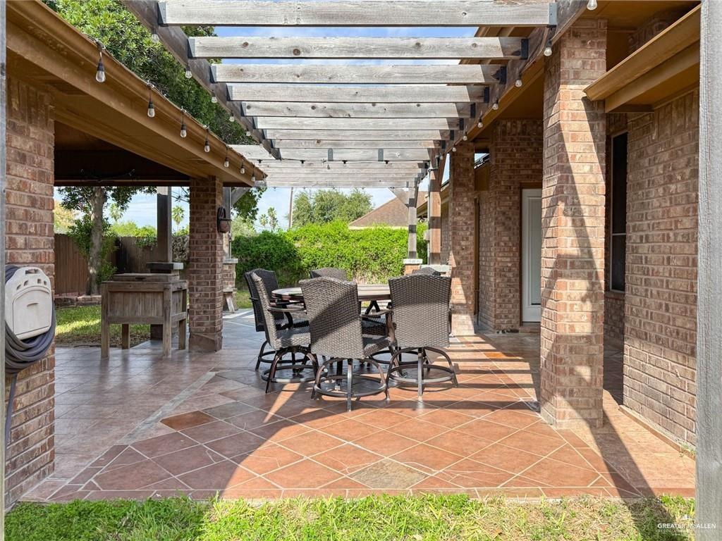 120 South Retama Lane Weslaco, TX 78596 - Photo 3 of 19 a view of outdoor dining space with a patio
