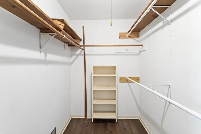 a view of an empty walk in closet