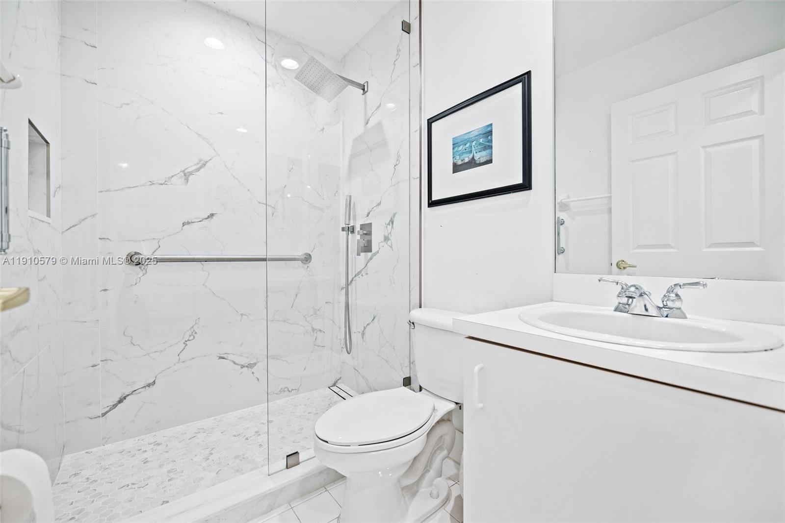 18746 Southwest 27th Court Miramar, FL 33029 - Photo 11 of 35 a bathroom with a sink toilet and shower