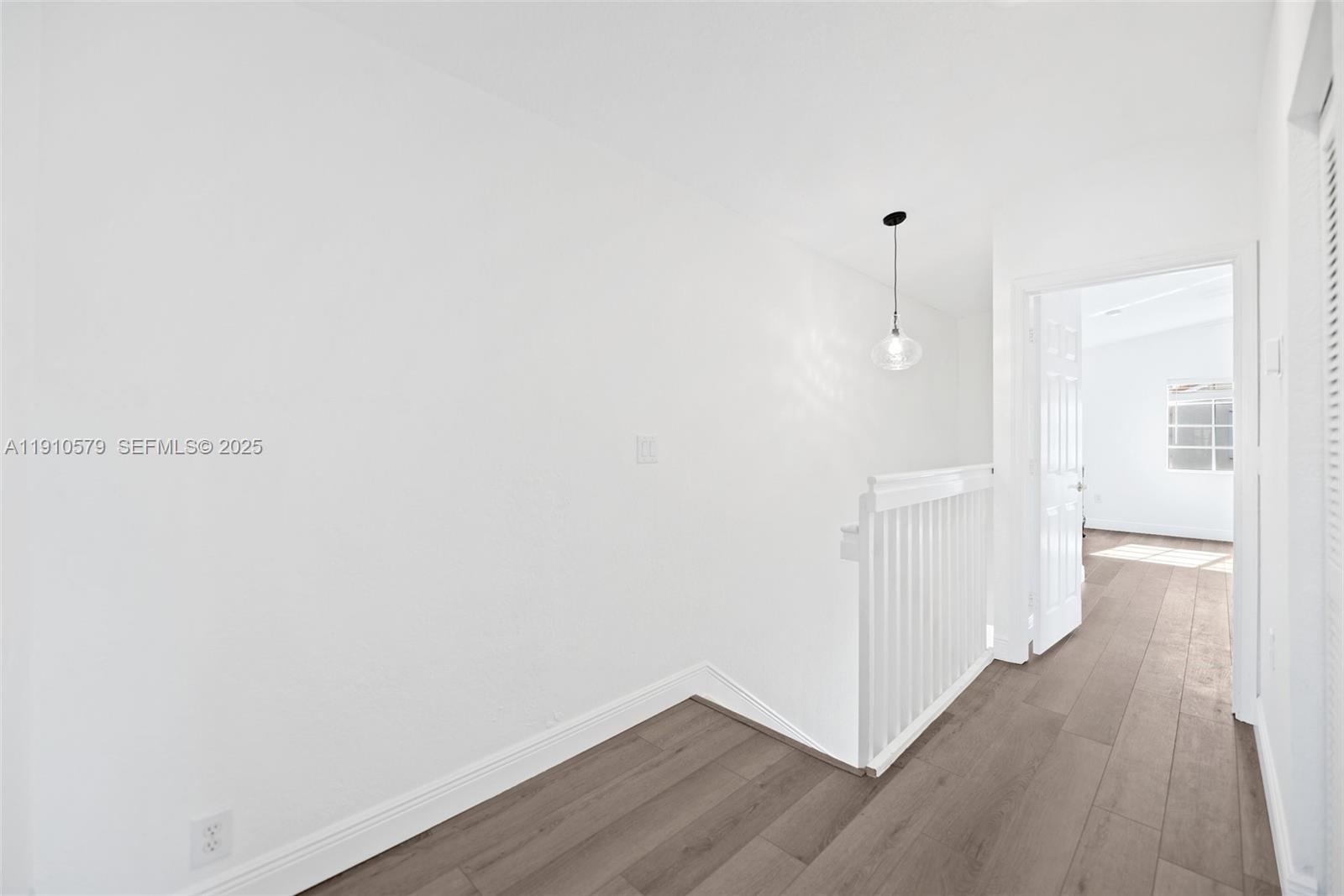 18746 Southwest 27th Court Miramar, FL 33029 - Photo 13 of 35 a view of a room with wooden floor