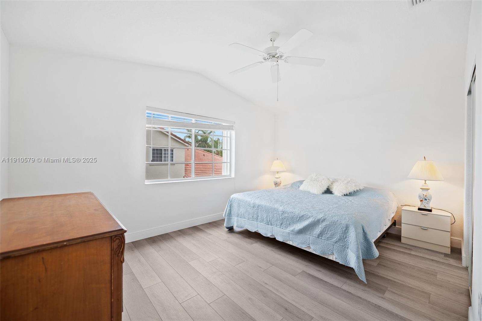 18746 Southwest 27th Court Miramar, FL 33029 - Photo 15 of 35 a bedroom with a bed and a window