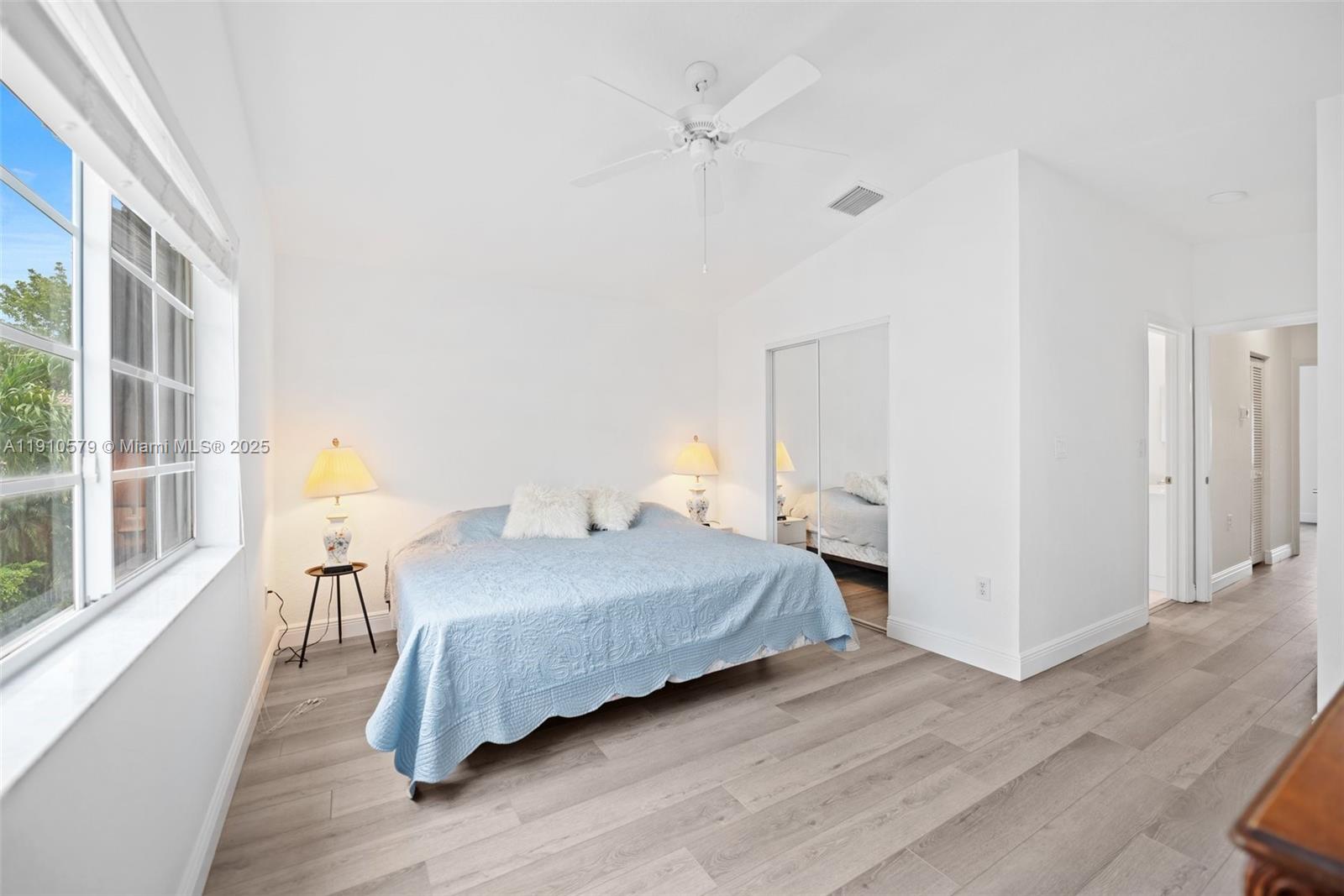 18746 Southwest 27th Court Miramar, FL 33029 - Photo 16 of 35 a bedroom with a bed and wooden floor