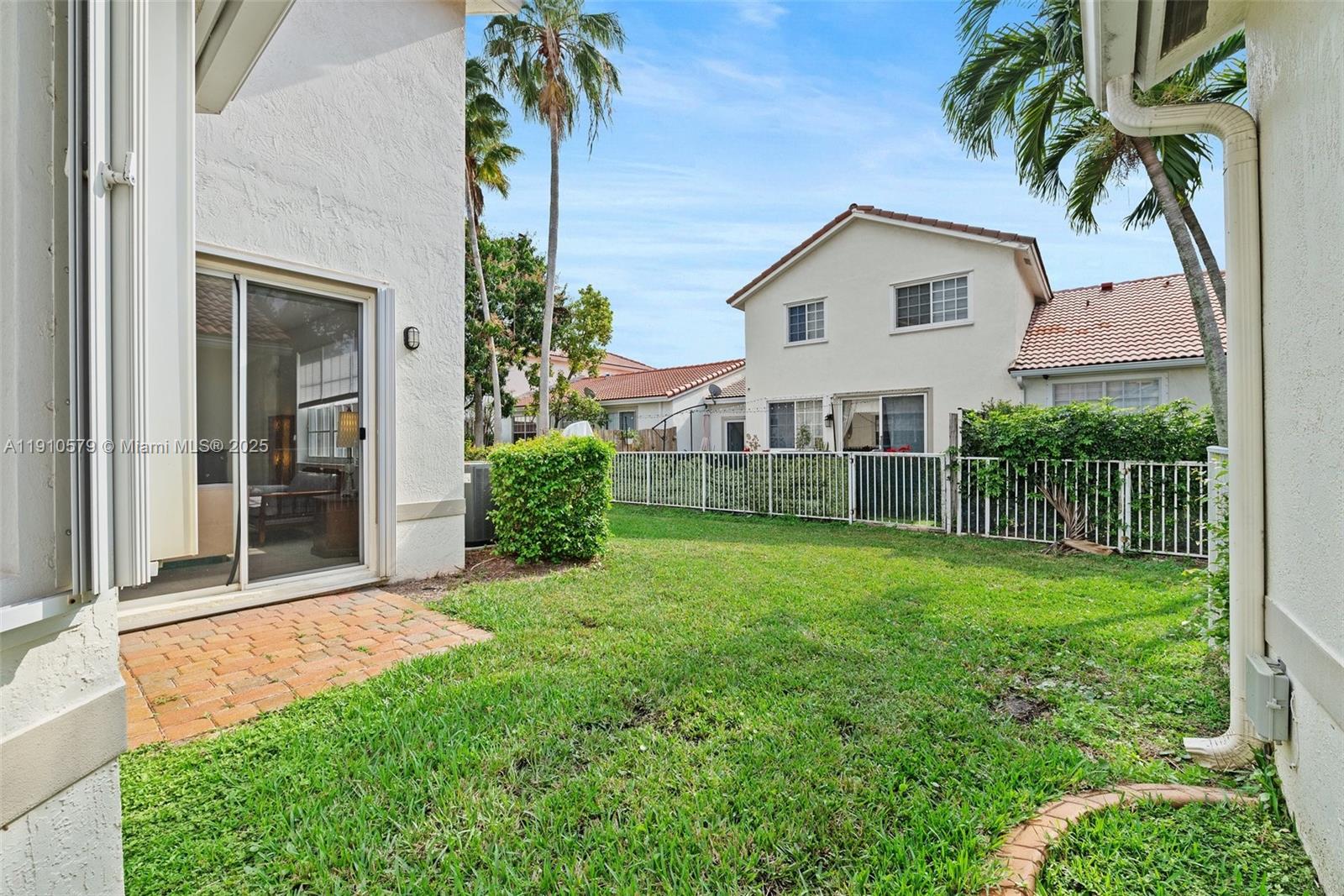18746 Southwest 27th Court Miramar, FL 33029 - Photo 24 of 35 a view of a backyard with plants and large trees