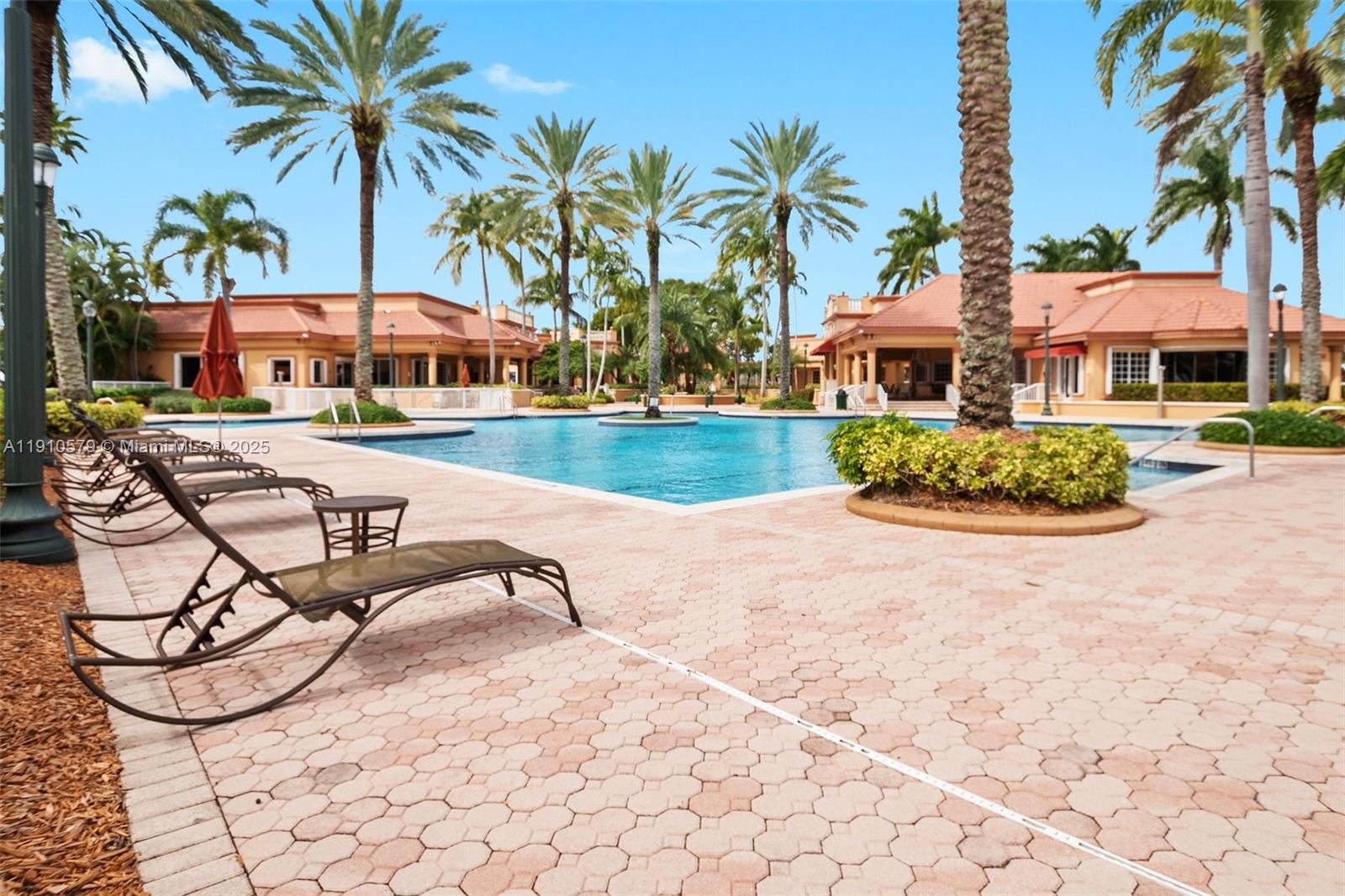 18746 Southwest 27th Court Miramar, FL 33029 - Photo 29 of 35 a swimming pool with outdoor seating and yard