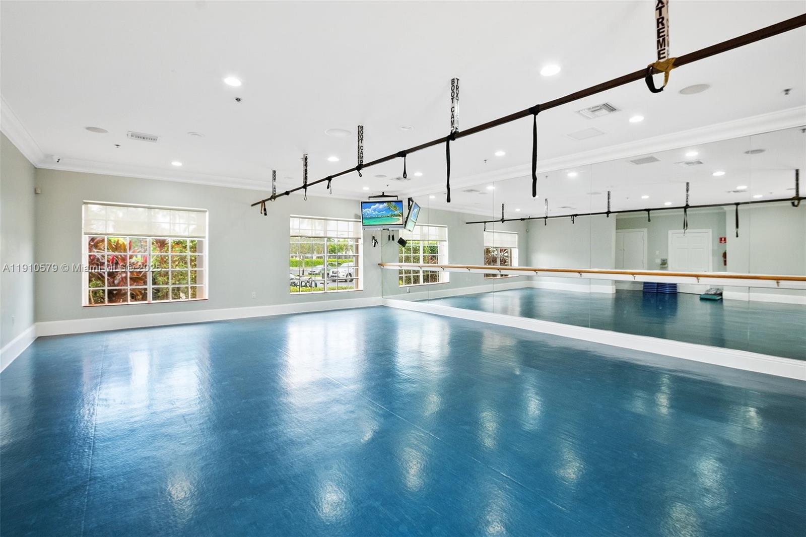 18746 Southwest 27th Court Miramar, FL 33029 - Photo 33 of 35 a view of a kitchen with kitchen island a large window a sink and a counter top space