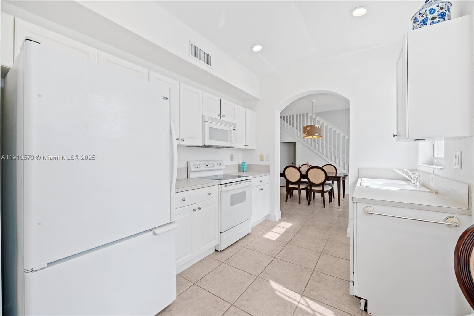 18746 Southwest 27th Court Miramar, FL 33029 - Photo 7 of 35 a kitchen with a cabinets and appliances