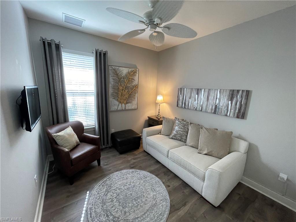 8328 Lucello Terrace North Naples, FL 34114 - Photo 13 of 22 a living room with furniture and a flat screen tv