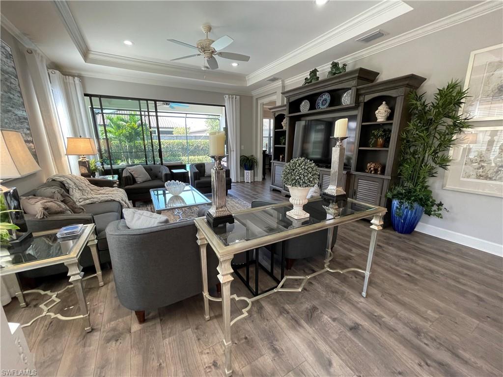 8328 Lucello Terrace North Naples, FL 34114 - Photo 8 of 22 a living room with furniture and wooden floor