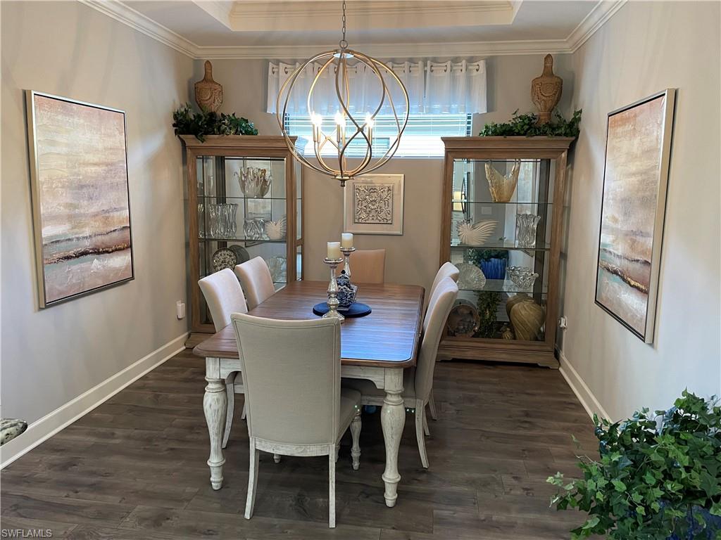 8328 Lucello Terrace North Naples, FL 34114 - Photo 9 of 22 a view of a dining room with furniture and window