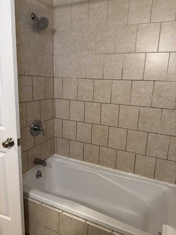 9 Kenney Street, Unit 1 Boston, MA 02130 - Photo 11 of 12 a bathroom with a bathtub