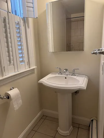a bathroom with a sink and mirror