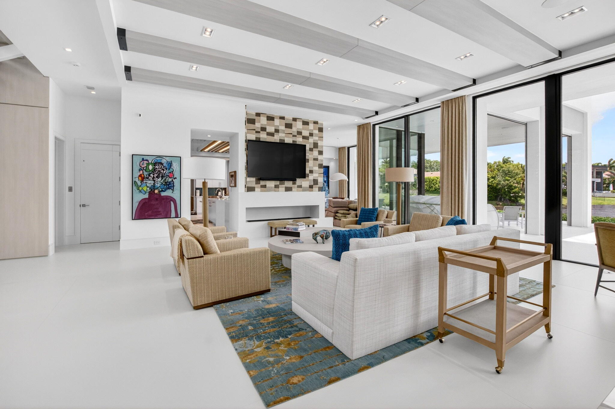 6960 Lake Estates Court Boca Raton, FL 33496 - Photo 6 of 58 a living room with furniture a flat screen tv and a large window