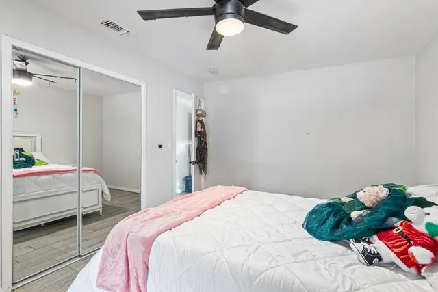 a bedroom with a bed and a window