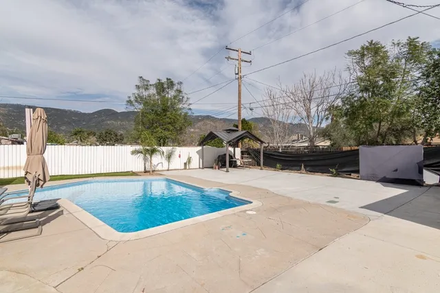 a view of a swimming pool with a lake