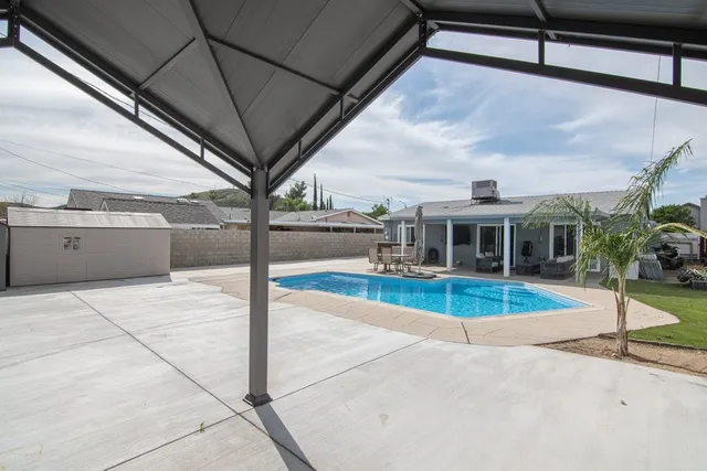 a view of a swimming pool with a patio