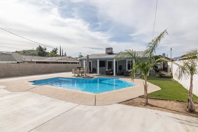 a view of a swimming pool with a lounge chairs