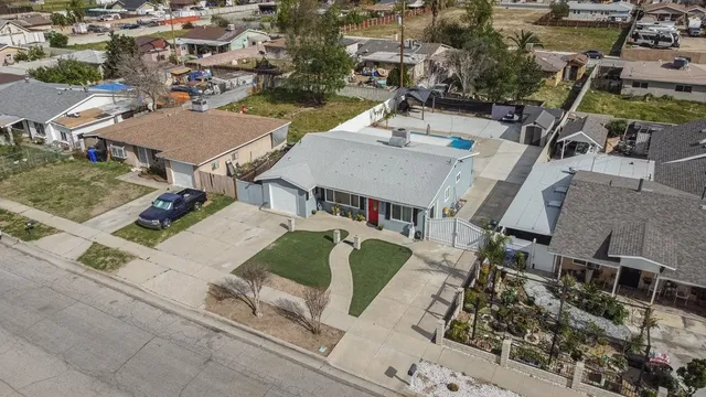 an aerial view of a house with outdoor space