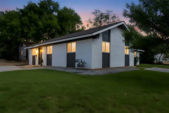 a backyard of a house with lots of green space
