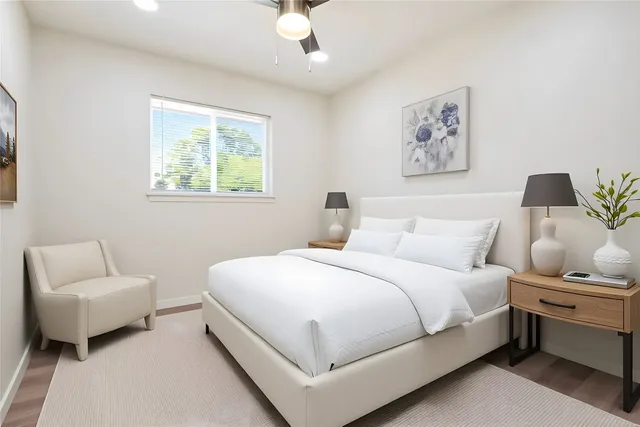 a bedroom with bed and a couch