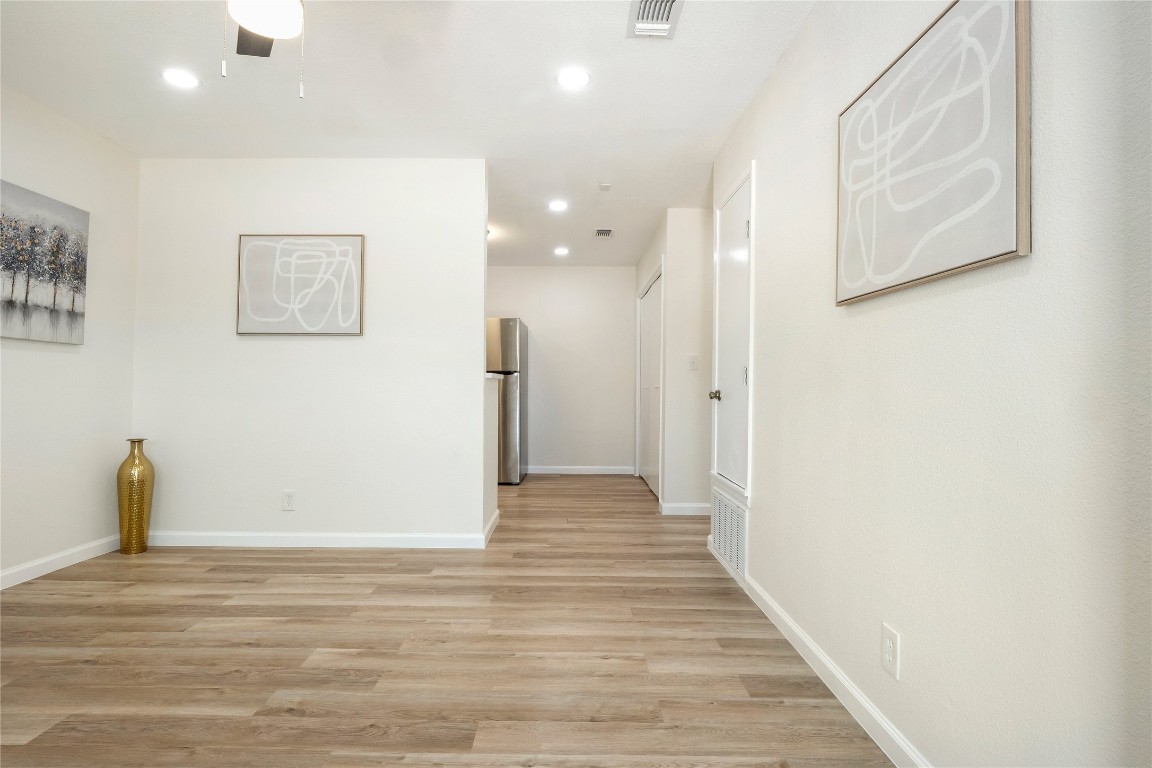 4913 Hawk Cove, Unit B Austin, TX 78745 - Photo 8 of 21 a view of a hallway with wooden floor