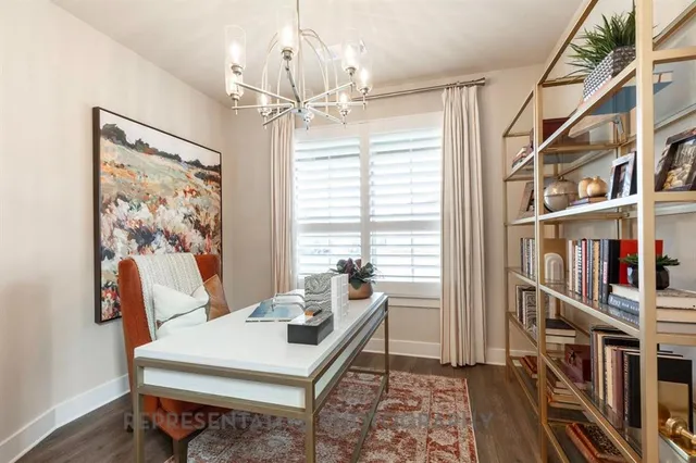 a room with furniture potted plant and a chandelier