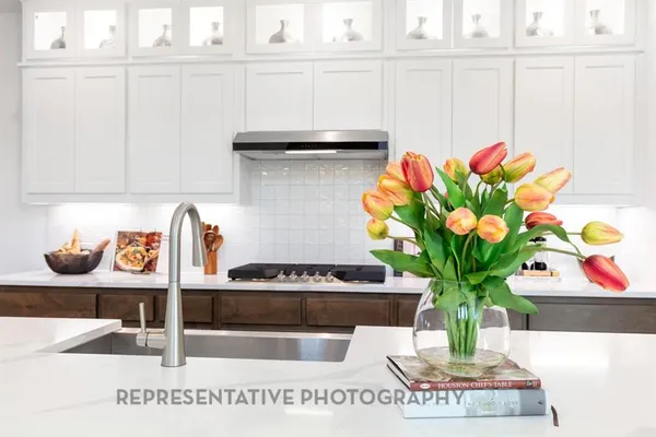a vase of flowers sitting on a shelf