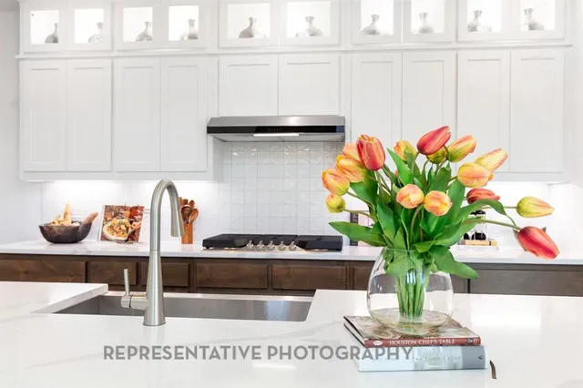a vase of flowers sitting on a shelf