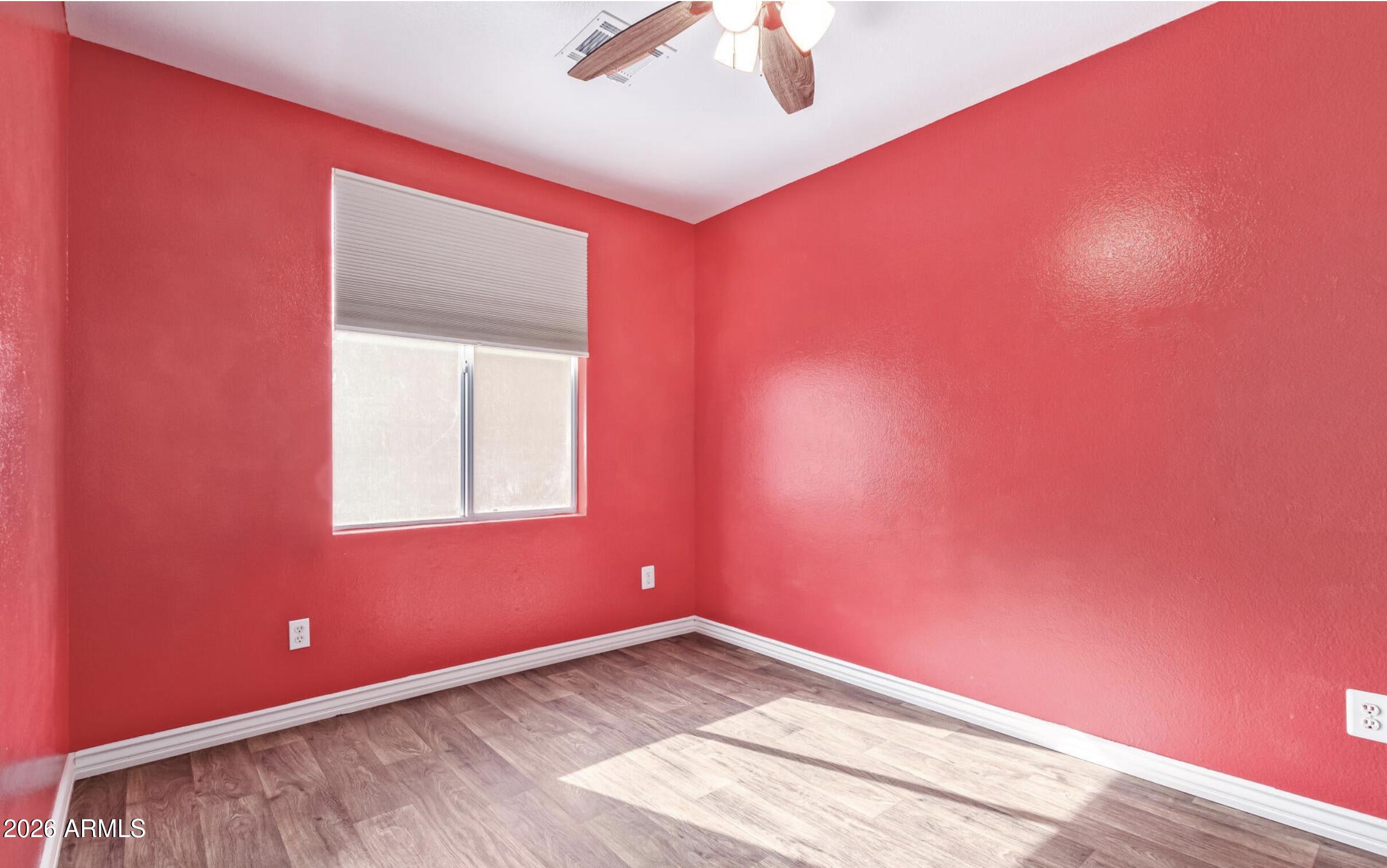 1825 West Renaissance Avenue Apache Junction, AZ 85120 - Photo 17 of 23 an empty room with a window