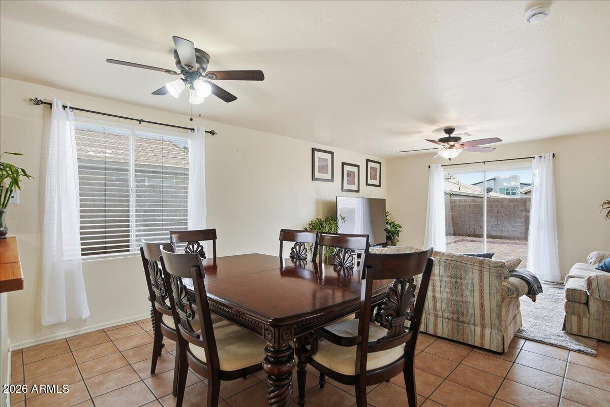 1825 West Renaissance Avenue Apache Junction, AZ 85120 - Photo 7 of 23 a view of a dining room with furniture and window