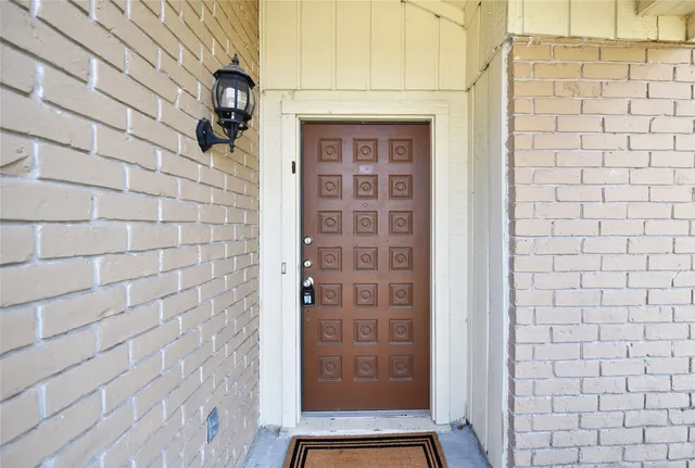 a view of a room with wooden floor and window